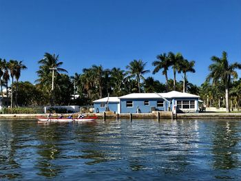 Scenic view of lake against clear blue sky