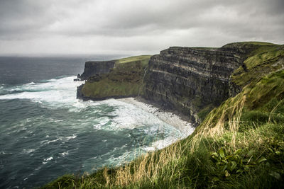 Cliff of moher panorama on atlantic ocean with stormy weather, ireland