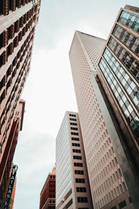 Low angle view of skyscrapers against sky