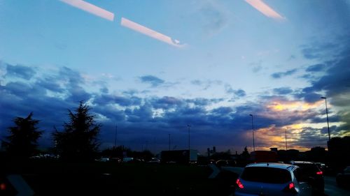 Cars on road against sky