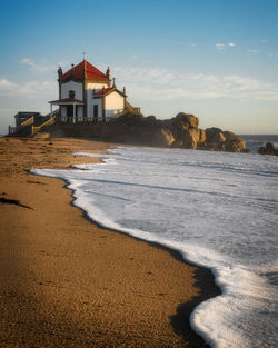 Senhor da pedra iconic chapel on the beach in miramar, portugal