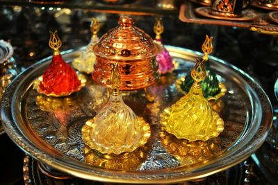 Close-up of various flowers in glass for sale