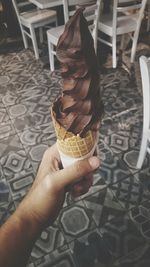 Close-up of hand holding ice cream