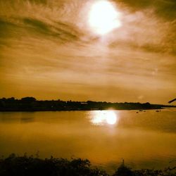 Scenic view of lake at sunset