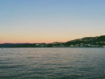 Scenic view of sea against clear sky during sunset