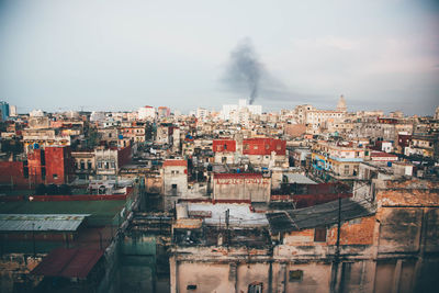 High angle view of buildings in city against sky