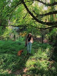 Man with dog in the forest