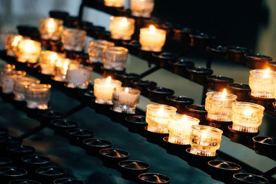 Close-up of burning candles at church