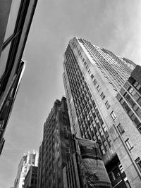 Low angle view of modern buildings against sky in city