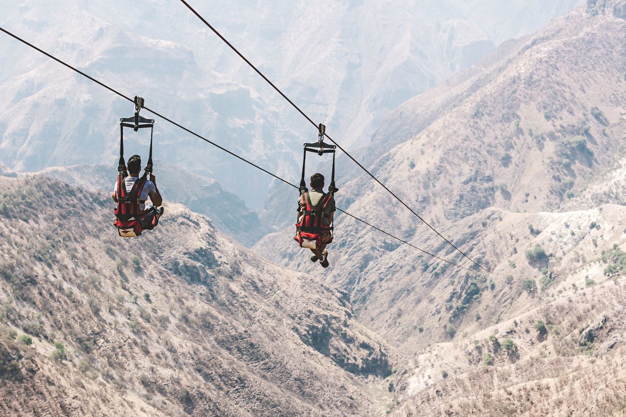 mountain, cable car, overhead cable car, nature, day, mountain range, ski lift, adventure, cable, snow, transportation, scenics - nature, real people, beauty in nature, travel, mode of transportation, outdoors, leisure activity, winter, two people