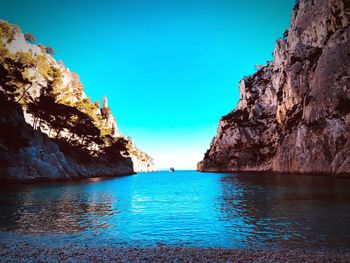 Scenic view of sea against clear blue sky