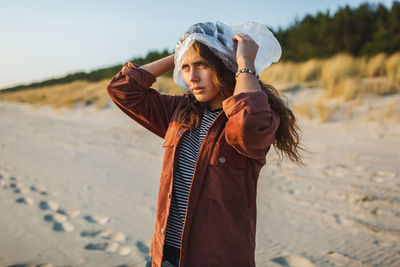 Young woman standing on beach