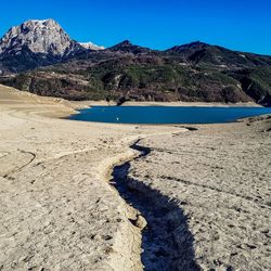 Scenic view of land against clear blue sky