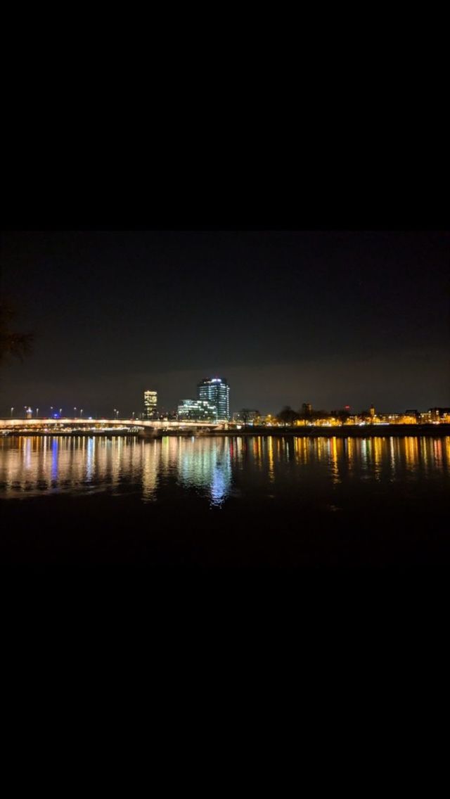 ILLUMINATED CITY AGAINST CLEAR SKY AT NIGHT