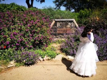 Rear view of girl walking outdoors