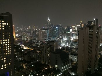 Illuminated buildings in city at night