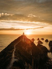 Scenic view of sea against sky during sunrise