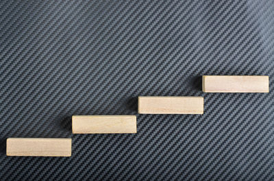 Directly above shot of wooden blocks on textile