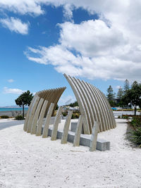 Built structure on beach against sky