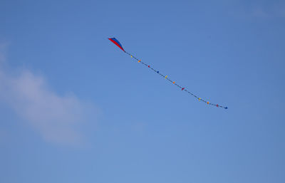 Low angle view of airshow against sky