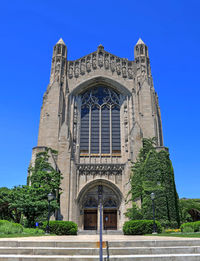 Low angle view of building against blue sky