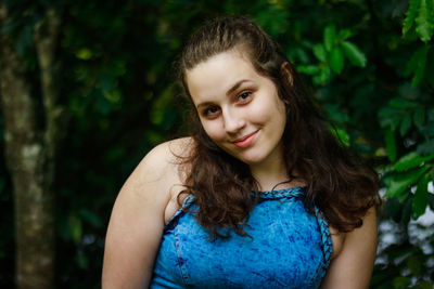 Close-up portrait of smiling young woman