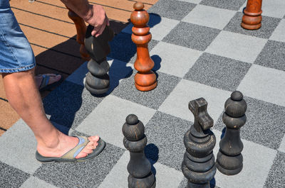 High angle view of men playing with chess