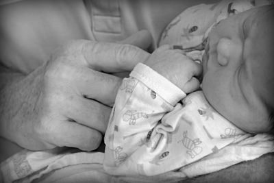 Close-up of baby holding hands