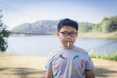 Portrait of boy eating lollipop