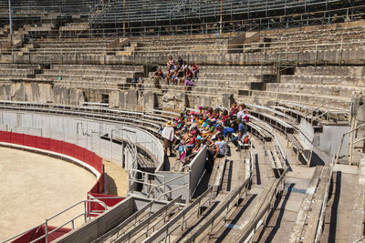 High angle view of people walking on staircase