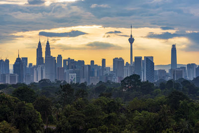 View of buildings against cloudy sky