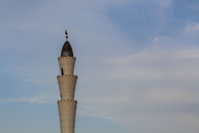 Low angle view of mosque minaret against sky