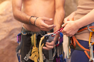 Midsection of man working at beach