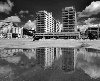 Buildings in city against sky