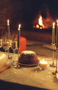 Close-up of illuminated candles on table