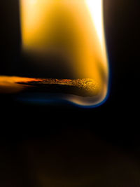 Close-up of illuminated drink against sky during sunset