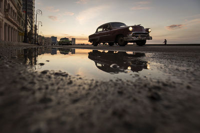 Reflection of building in puddle