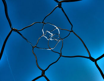 Low angle view of bare tree against blue sky