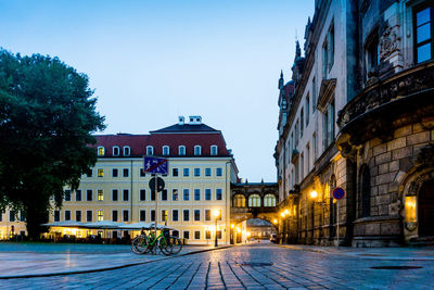 Church of our lady by buildings against sky