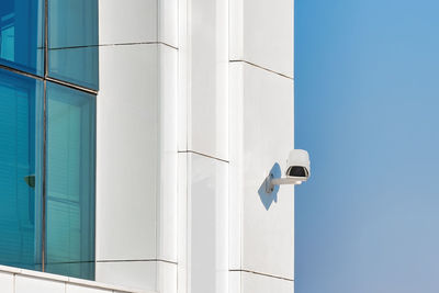 Low angle view of building against clear blue sky