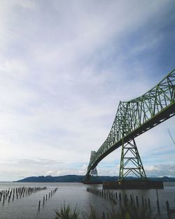 Low angle view of astoriamegler bridge over columbia river against sky