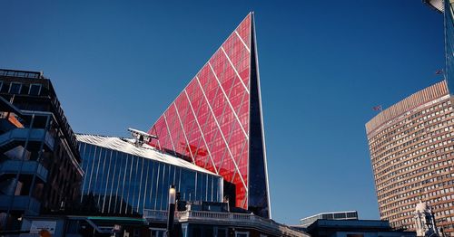 Low angle view of buildings against blue sky