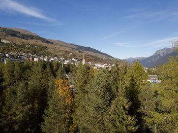 Panoramic view of trees and mountains against sky