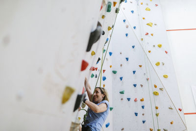 Woman on climbing wall