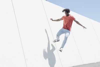 Energetic man jumping on ramp