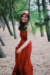 Portrait of a smiling young woman standing outdoors