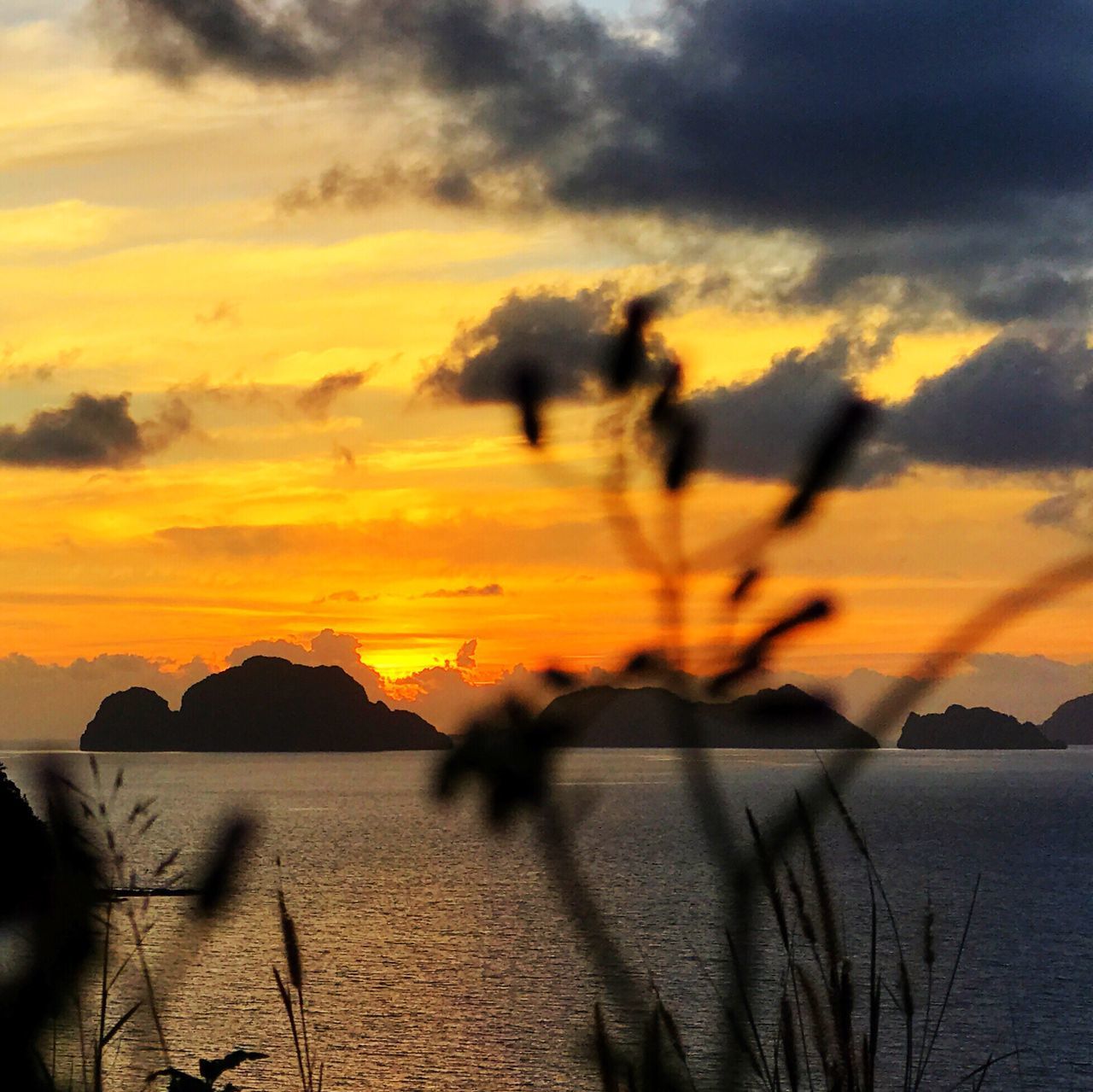 sunset, nature, beauty in nature, sky, scenics, silhouette, tranquil scene, water, tranquility, outdoors, cloud - sky, no people, sea, yellow, mountain, day