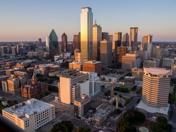Skyline of dallas, texas, seen from the reunion tower with golden sun and dallas county courthouse.