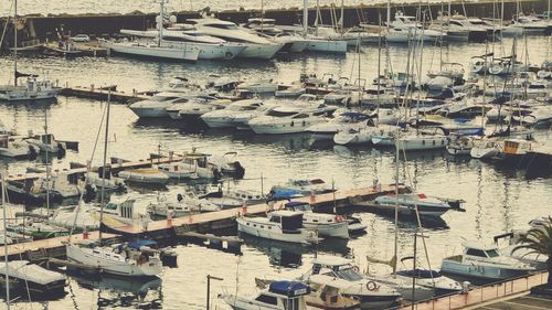 High angle view of boats moored at harbor