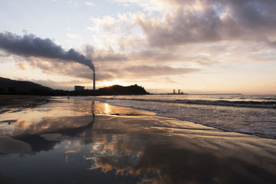 Scenic view of sea against cloudy sky